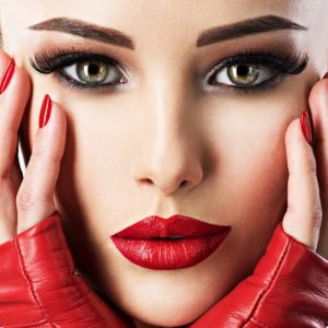 beautiful woman with bright fashion make-up and red lipstick on sexy lips. Closeup portrait.